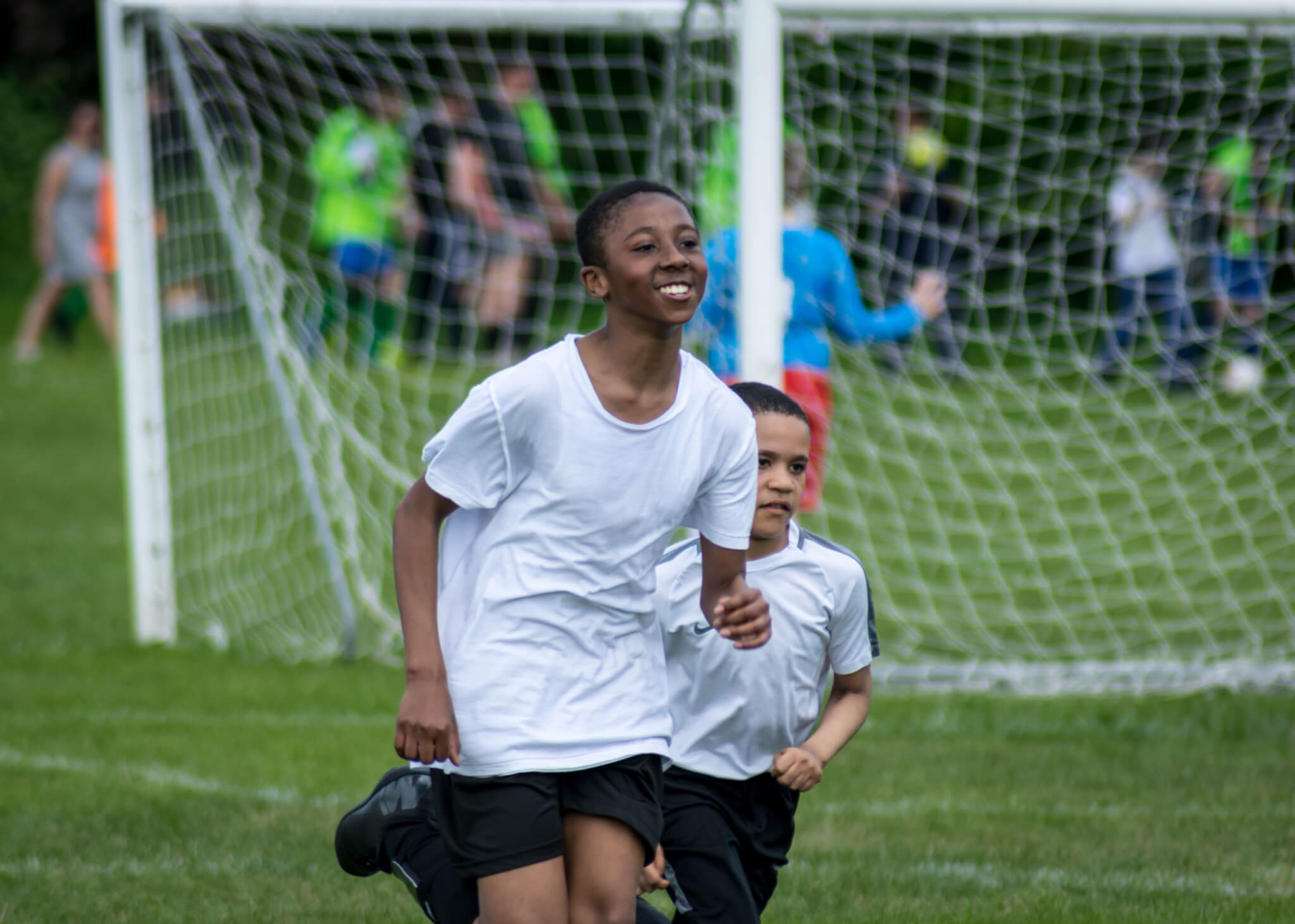 Boys running in a London playing field