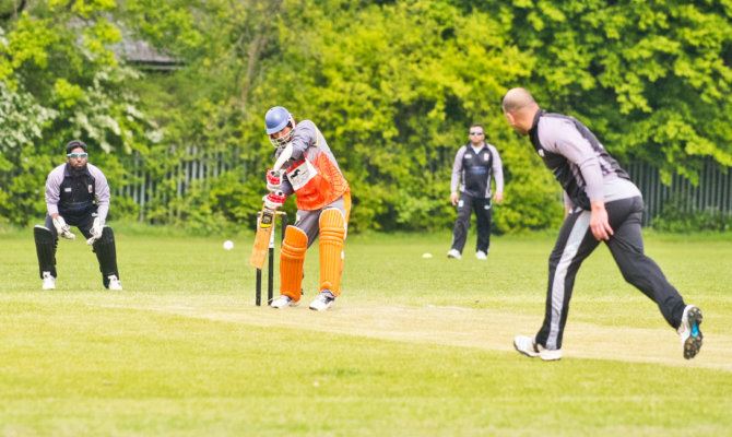 Game of cricket at Peter May Sports Ground
