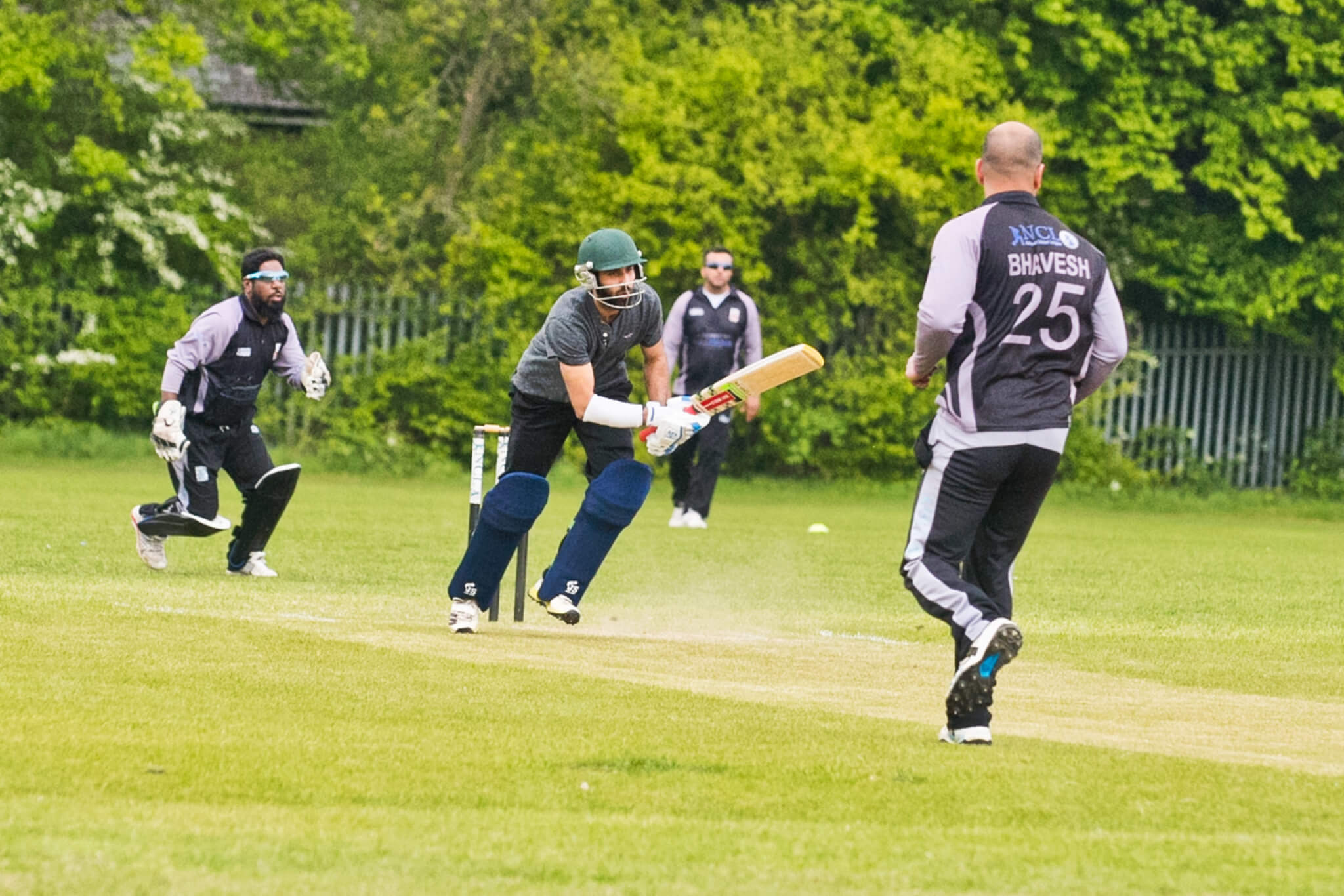 Cricket game in action - London Playing Field