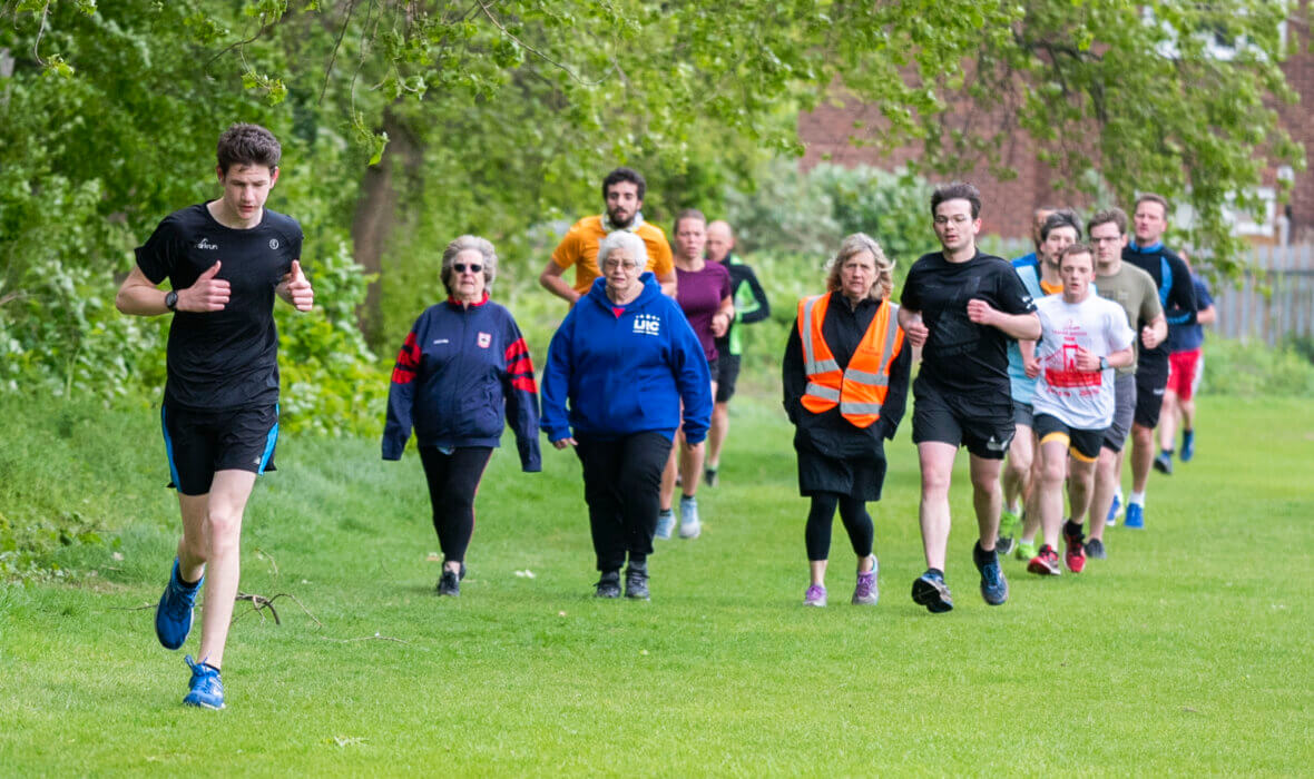 Donate - people running at peter May Sports Ground