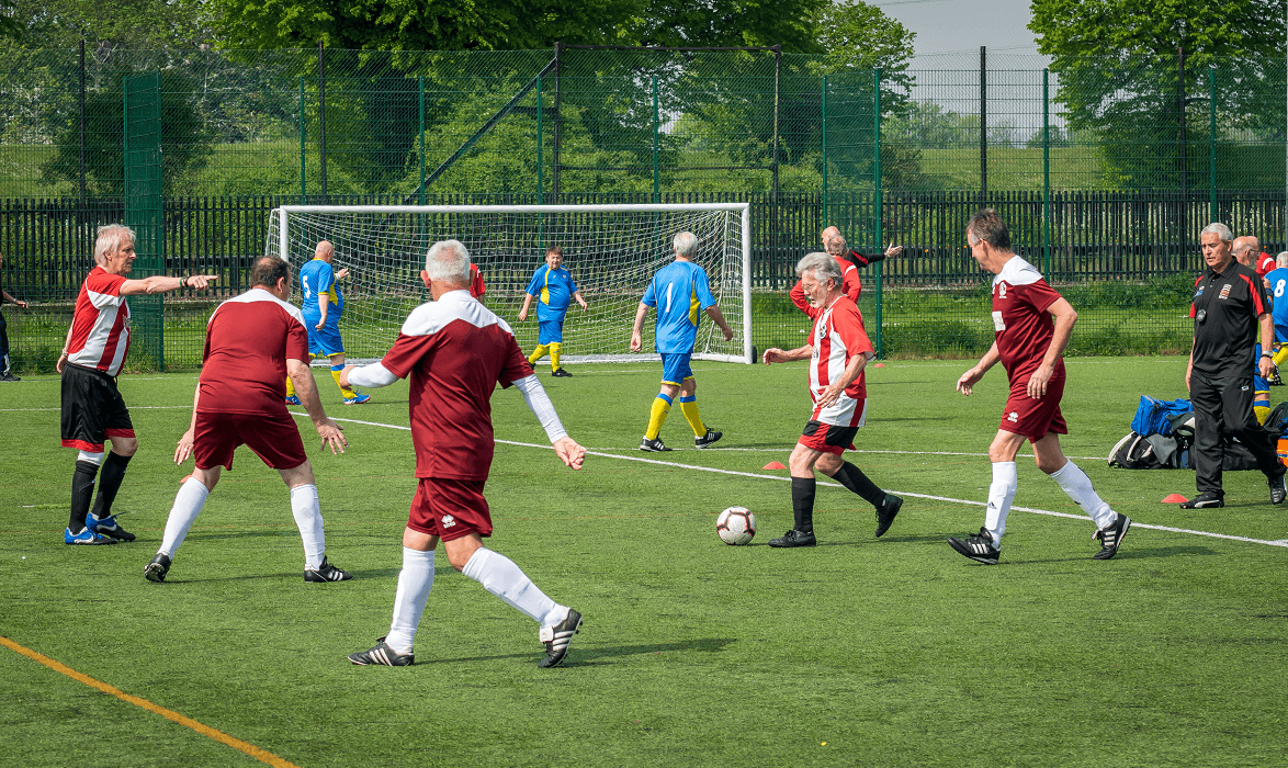 Mature football players mid game