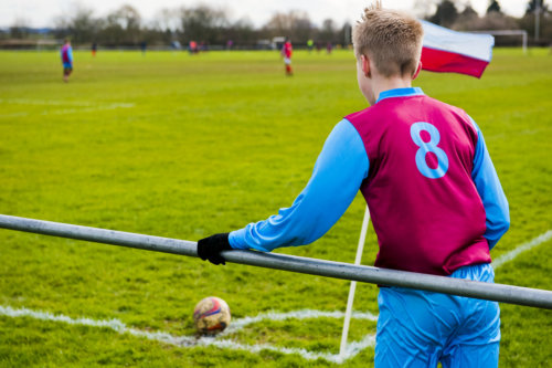 Football player taking a corner - our charter