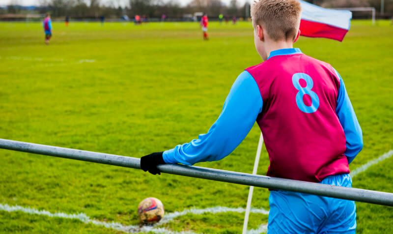 Football player taking a corner - our charter