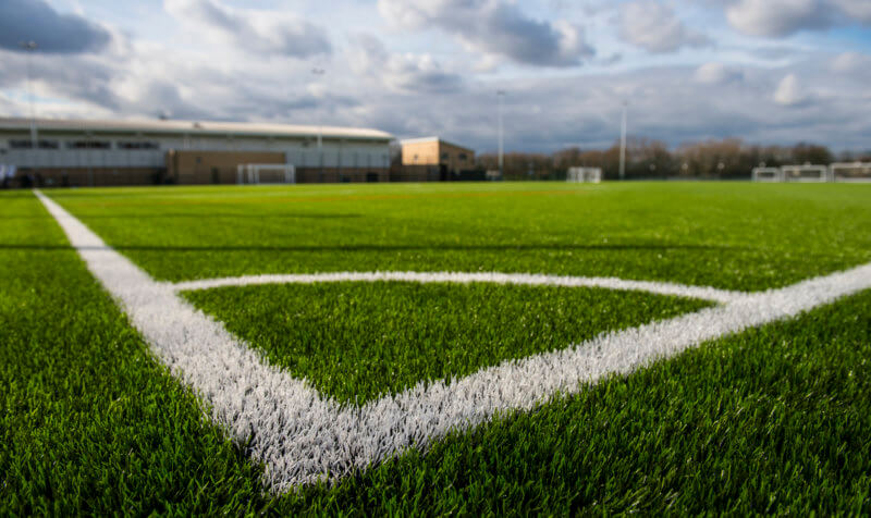 White markings on the corner of a playing field