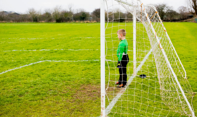 Young football player in goal