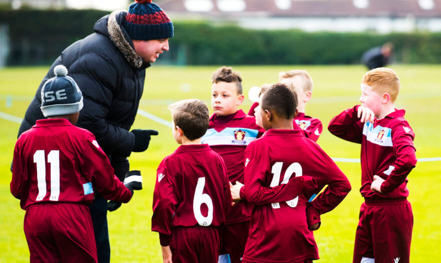 young football players being coached - giving to LPFF